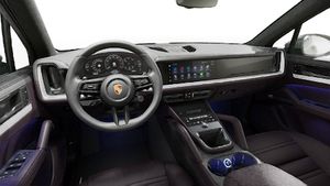 Interior view showing the steering wheel and dashboard of Cayenne