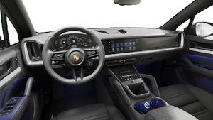 Interior view showing the steering wheel and dashboard of Cayenne
