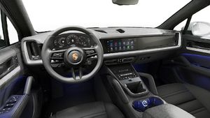 Interior view showing the steering wheel and dashboard of Cayenne
