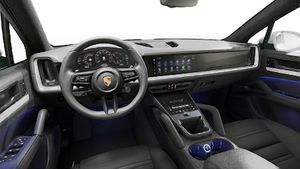 Interior view showing the steering wheel and dashboard of Cayenne