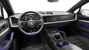 Interior view showing the steering wheel and dashboard of Cayenne E-Hybrid