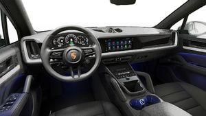 Interior view showing the steering wheel and dashboard of Cayenne E-Hybrid