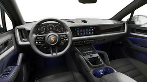 Interior view showing the steering wheel and dashboard of Cayenne S