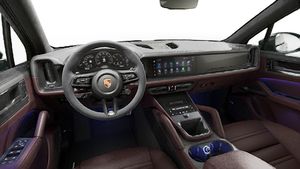 Interior view showing the steering wheel and dashboard of Cayenne GTS