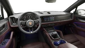 Interior view showing the steering wheel and dashboard of Cayenne GTS