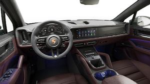Interior view showing the steering wheel and dashboard of Cayenne GTS