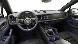 Interior view showing the steering wheel and dashboard of Cayenne GTS