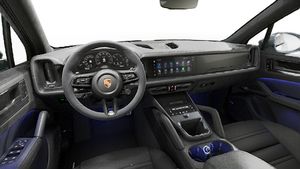 Interior view showing the steering wheel and dashboard of Cayenne GTS