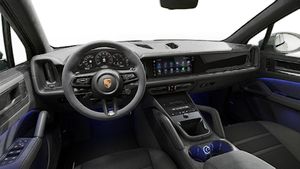 Interior view showing the steering wheel and dashboard of Cayenne GTS