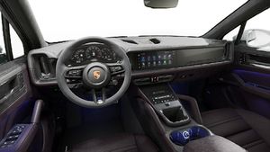 Interior view showing the steering wheel and dashboard of Cayenne GTS