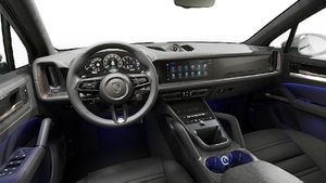 Interior view showing the steering wheel and dashboard of Cayenne Turbo E-Hybrid