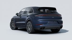 Exterior view of Cayenne Turbo E-Hybrid showing the back and left side of the car
