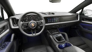 Interior view showing the steering wheel and dashboard of Cayenne Coupe