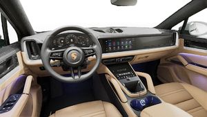 Interior view showing the steering wheel and dashboard of Cayenne Coupe