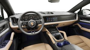 Interior view showing the steering wheel and dashboard of Cayenne Coupe