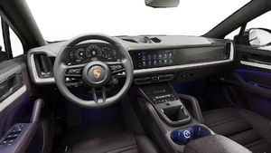 Interior view showing the steering wheel and dashboard of Cayenne Coupe