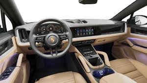 Interior view showing the steering wheel and dashboard of Cayenne Coupe