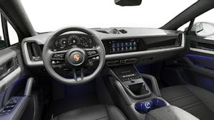 Interior view showing the steering wheel and dashboard of Cayenne Coupe