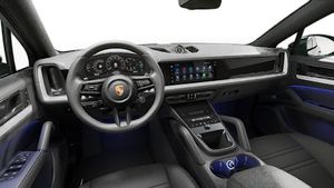 Interior view showing the steering wheel and dashboard of Cayenne Coupe