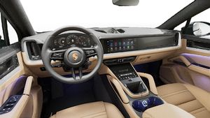 Interior view showing the steering wheel and dashboard of Cayenne Coupe