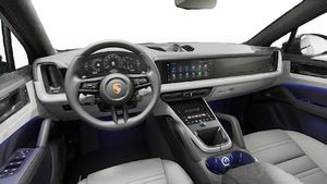 Interior view showing the steering wheel and dashboard of Cayenne Coupe