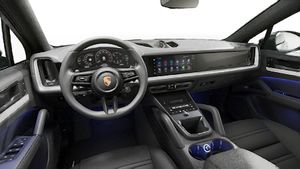 Interior view showing the steering wheel and dashboard of Cayenne Coupe