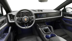 Interior view showing the steering wheel and dashboard of Cayenne Coupe