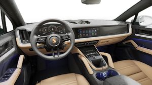 Interior view showing the steering wheel and dashboard of Cayenne Coupe