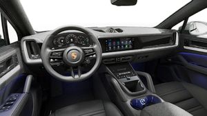 Interior view showing the steering wheel and dashboard of Cayenne Coupe