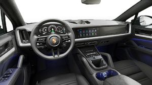 Interior view showing the steering wheel and dashboard of Cayenne E-Hybrid Coupe