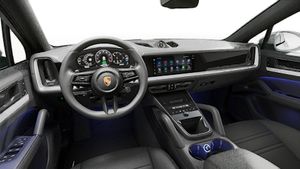 Interior view showing the steering wheel and dashboard of Cayenne S E-Hybrid Coupe