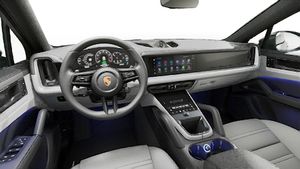 Interior view showing the steering wheel and dashboard of Cayenne S E-Hybrid Coupe