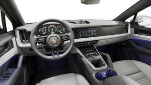Interior view showing the steering wheel and dashboard of Cayenne S E-Hybrid Coupe
