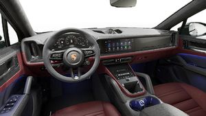 Interior view showing the steering wheel and dashboard of Cayenne GTS Coupe