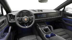 Interior view showing the steering wheel and dashboard of Cayenne GTS Coupe