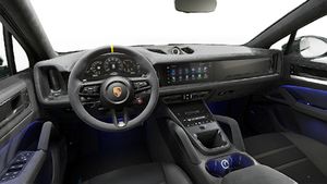 Interior view showing the steering wheel and dashboard of Cayenne Turbo GT