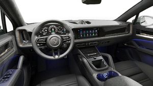 Interior view showing the steering wheel and dashboard of Cayenne Turbo E-Hybrid Coupe