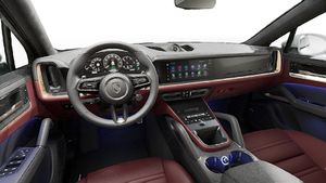 Interior view showing the steering wheel and dashboard of Cayenne Turbo E-Hybrid Coupe