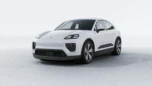 Exterior view of Macan Electric showing the front and left side of the car
