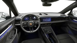 Interior view showing the steering wheel and dashboard of Macan 4 Electric