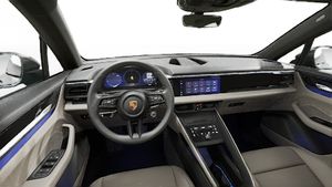 Interior view showing the steering wheel and dashboard of Macan 4 Electric
