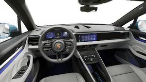 Interior view showing the steering wheel and dashboard of Macan 4 Electric