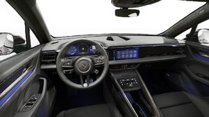Interior view showing the steering wheel and dashboard of Macan Turbo Electric