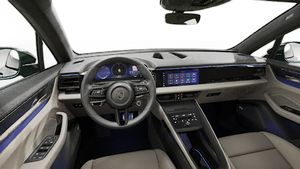Interior view showing the steering wheel and dashboard of Macan Turbo Electric