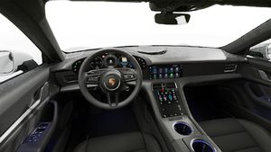 Interior view showing the steering wheel and dashboard of Taycan