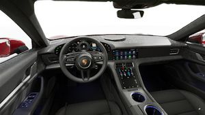Interior view showing the steering wheel and dashboard of Taycan 4S