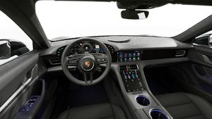 Interior view showing the steering wheel and dashboard of Taycan 4S