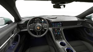 Interior view showing the steering wheel and dashboard of Taycan 4S