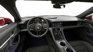 Interior view showing the steering wheel and dashboard of Taycan 4S
