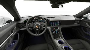 Interior view showing the steering wheel and dashboard of Taycan 4S